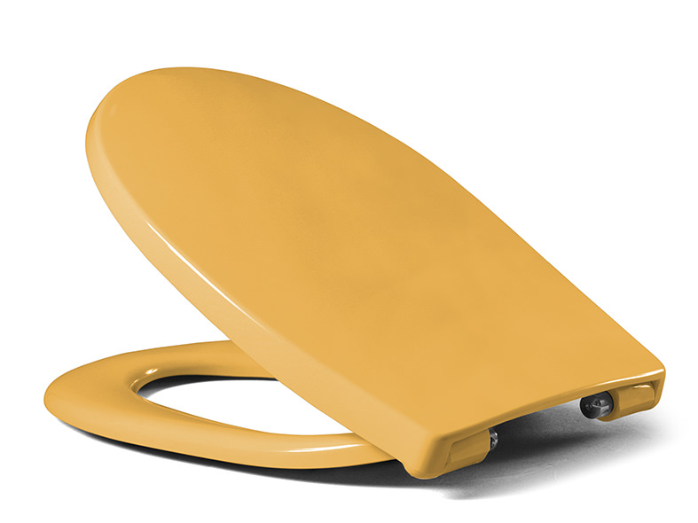 A toilet seat made of plastic in yellow provides a bright and friendly ambience.